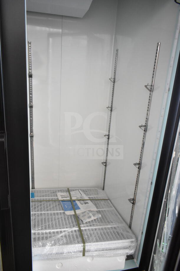 Brand new Avantco 178GDC49FHCB 2-door cooler merchandiser, visible glass damage, 115V, 1 Phase, interior shelving included.
