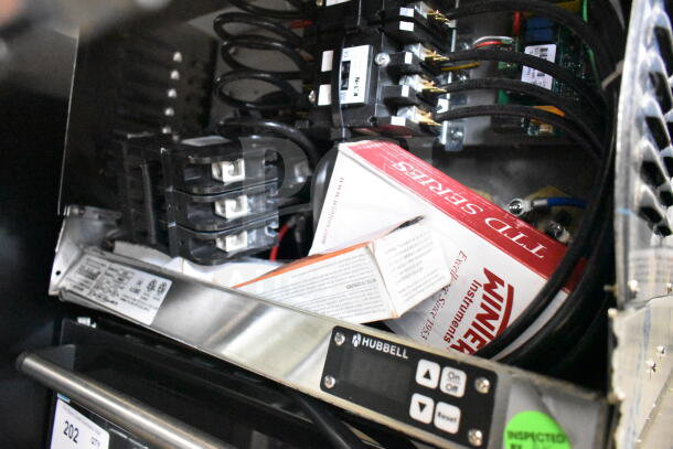 BRAND NEW Hubbell J654R 6 Gallon Compact Booster Heater, 208V, 3 Phase; visible controls, slight dents, original packaging.