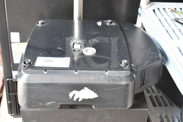 Hobart countertop food portioning scale on stand, black, shows some wear. Label indicates 208 volts, single phase.