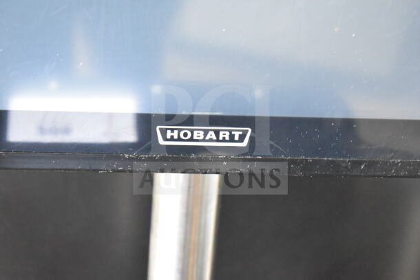 Hobart commercial food portioning scale on stand, countertop model. Features 120/208-240V, 1 phase. Appears used.