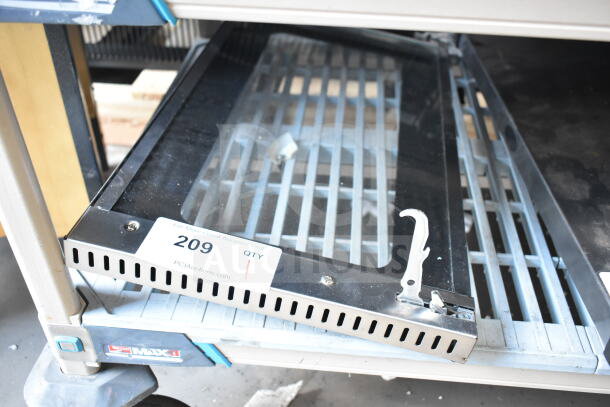 Brand new convection oven replacement door with scratch and dent, metal frame, glass panel, and latch mechanism. Tag: "209 QTY".