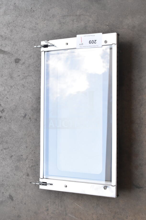 Brand new convection oven replacement door with minor scratches, stainless steel frame, and visible packaging label.