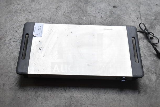 Nostalgia countertop electric griddle, 115V, 1 phase, with handles and power cord; shows light wear and some surface marks.