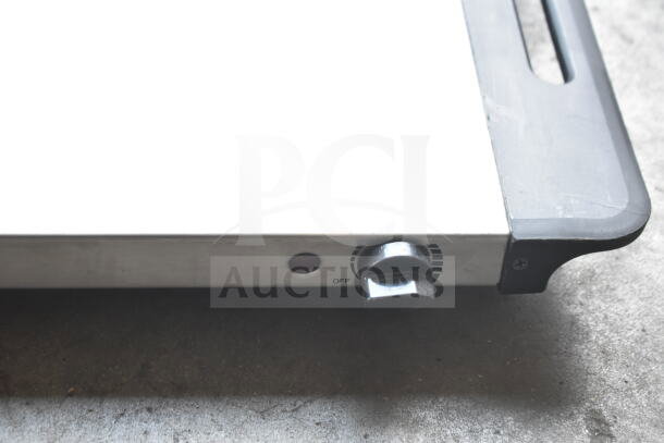 Nostalgia countertop electric griddle in silver, 115 volts, 1 phase. Features control knob and sturdy design.
