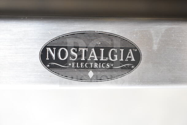 Nostalgia Electrics logo on a countertop electric griddle. 115 volts, 1 phase. Stainless steel finish, gently used condition.