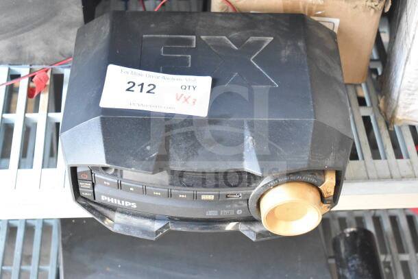 Philips FX10/37 stereo with two speakers; lightly used, label marked "212 QTY VX3," visible dust on surface.