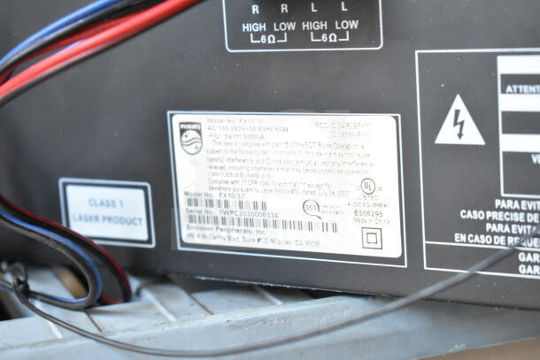 Philips FX10/37 stereo label showing model, FCC ID 2AARB5FX10, serial YWPC2030006334, and UL listing.
