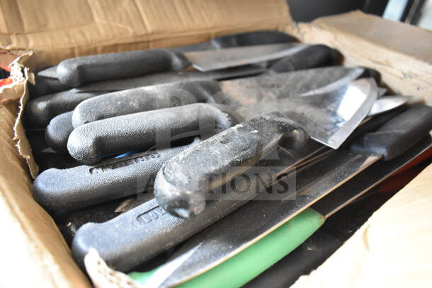 Box of 50 sharpened stainless steel chef knives with black handles, excellent condition. Sold as a bulk auction lot.