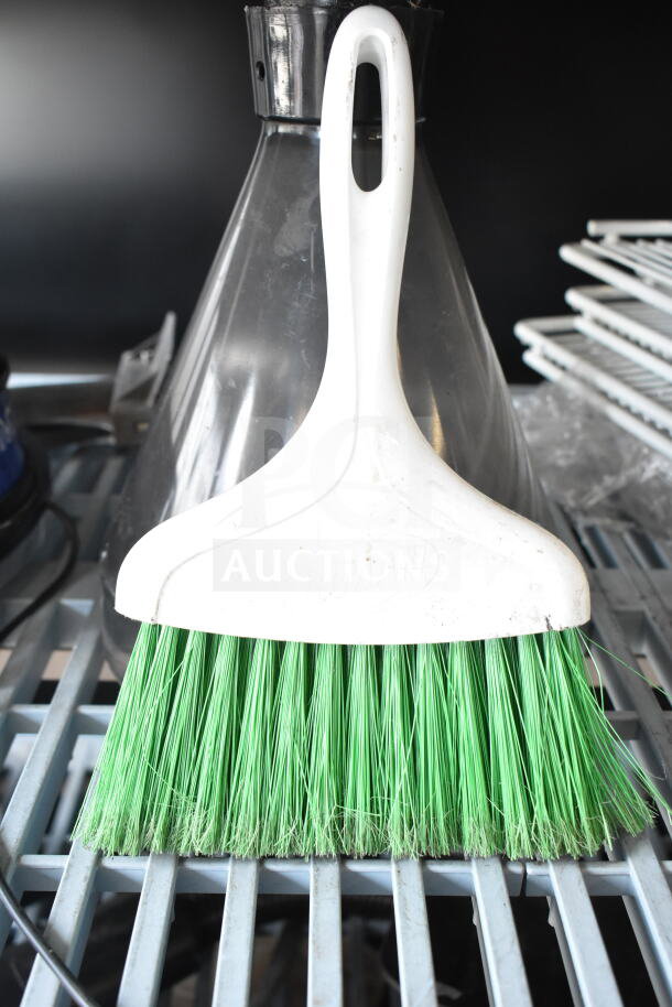 Various items including a white and green dustpan broom, part of an 8-item auction featuring equipment hoppers.