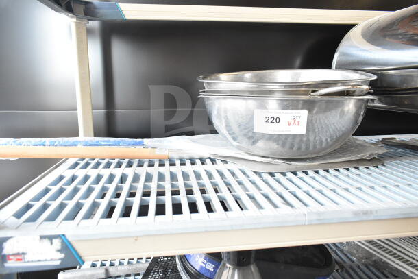 5 various items including metal bowls with visible label "220 VXS" and an Azzurra pizza peel on a shelf.