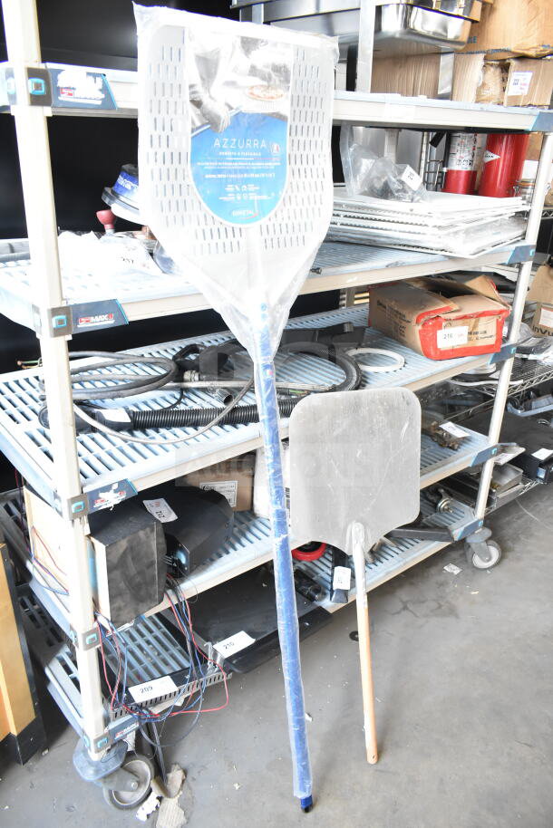 5 items including a blue Azzurra pizza peel in packaging, metal bowls, stored on industrial shelving.