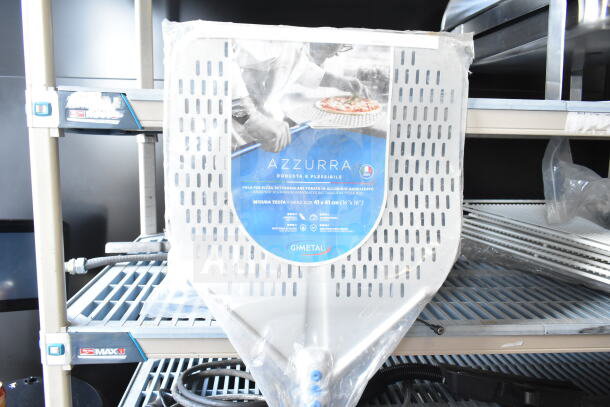 Azzurra pizza peel, anodized aluminum, perforated, 41x41cm. Marked "Robusta e Flessibile" in packaging on metal shelf.