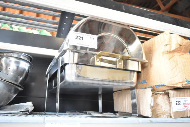 Stainless steel countertop roll top chafer with brass handles, in good condition. Auction label marked "221 QTY 1".