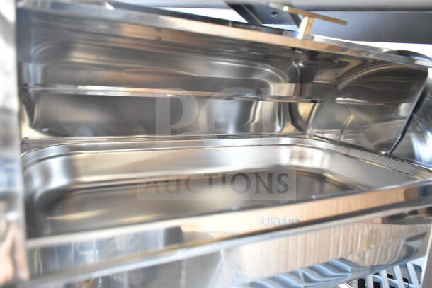 Stainless steel countertop roll top chafer, excellent condition, interior view shows smooth, polished finish. Ideal for catering.