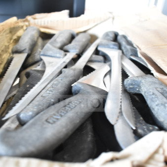 Box of 60 sharpened stainless steel knives, including rocking and serrated types. Knives feature durable black handles.
