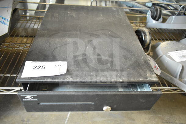 Black countertop cash drawer, used condition, visible dust and wear. Features a lock and slot for cash. Tag reads "225 QTY".