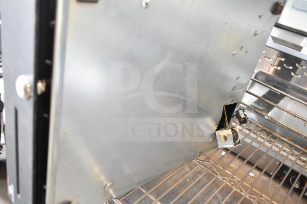 Black countertop cash drawer, metal construction, good condition, visible lock mechanism, suitable for retail use.
