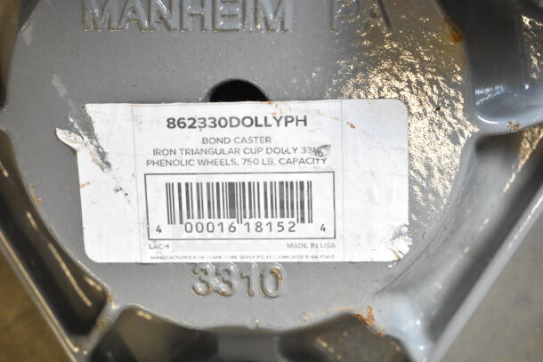 Bond 750 lb. cast steel triangular cup dolly with phenolic casters, model 862330DOLLYPH, label showing capacity.