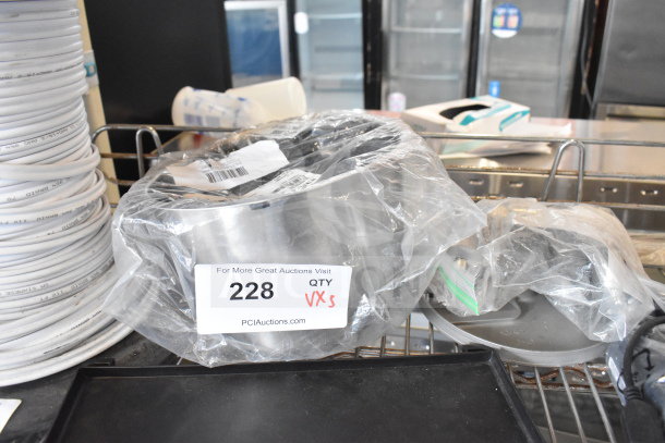3 mixed items in plastic, including a brew basket and legs. Auction tag states "228 QTY VARS." Item condition unclear.
