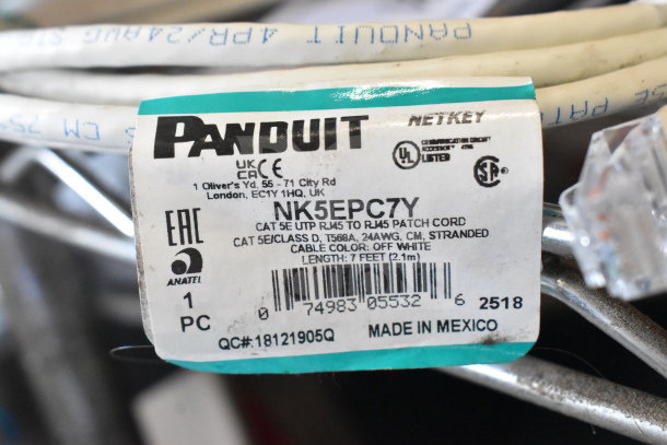 Panduit NetKey Cat 5E UTP RJ45 patch cord, model NK5EPC7Y. Off-white, 7 ft length, 24AWG, made in Mexico.