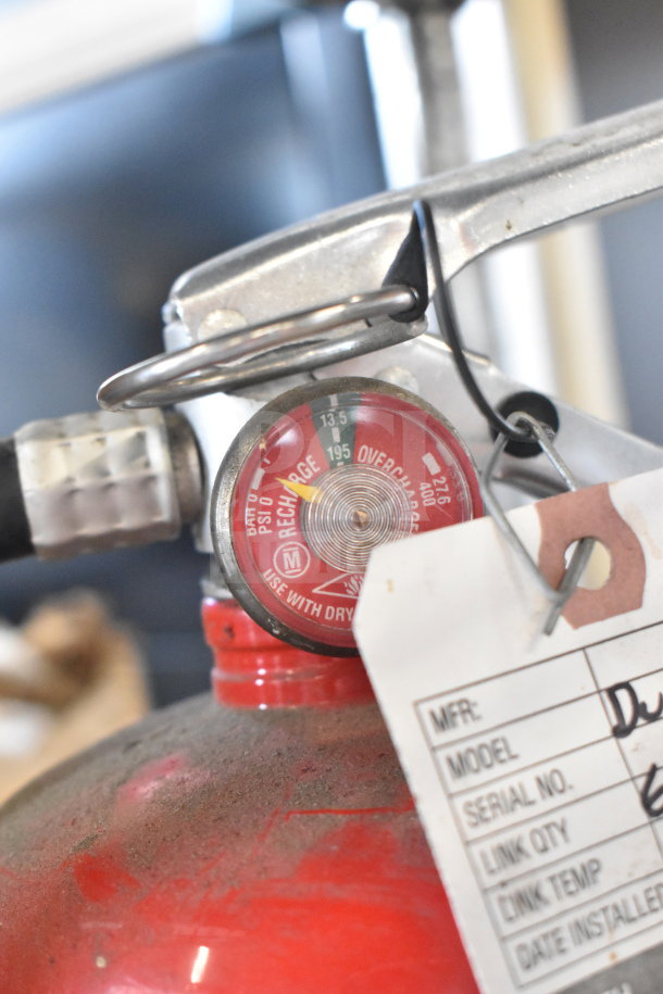 Two fire extinguishers, including an Amerex, with pressure gauge visible. Tag shows usage details. Buyer pickup only.