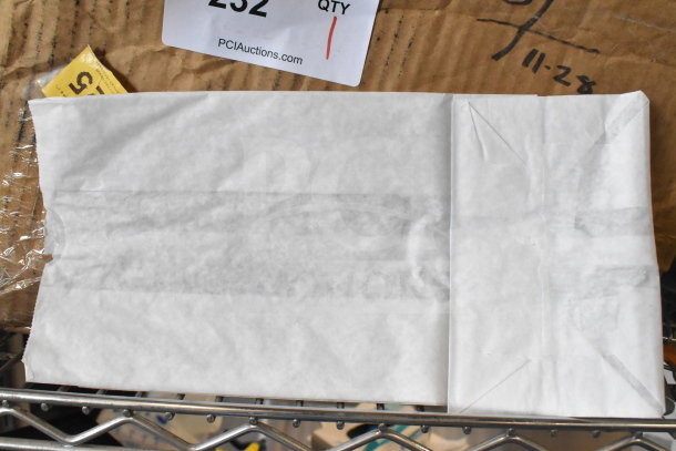 Box of white paper bags, new condition, labeled as item 232 by PCIAuctions.com.