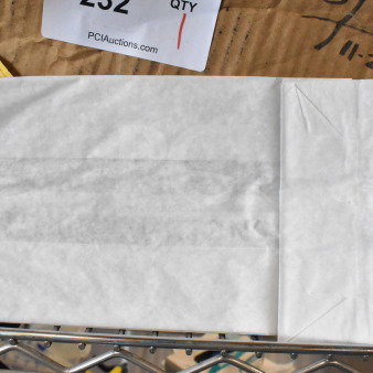Box of white paper bags, new condition, labeled as item 232 by PCIAuctions.com.
