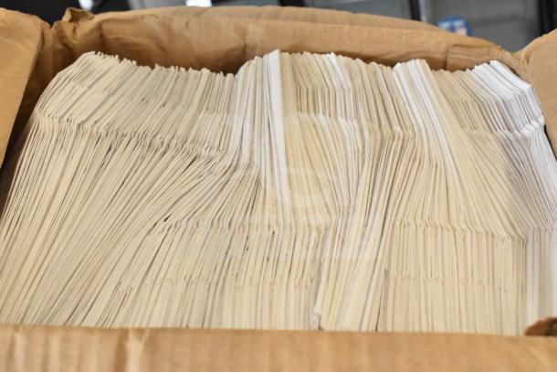Box filled with neatly stacked white paper bags, in excellent condition, suitable for retail or packaging use.