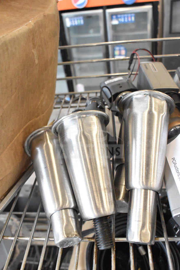 Assorted Bosch cameras and metal tripod legs on a wire shelf, showing minor wear, auctioned as a bulk item.