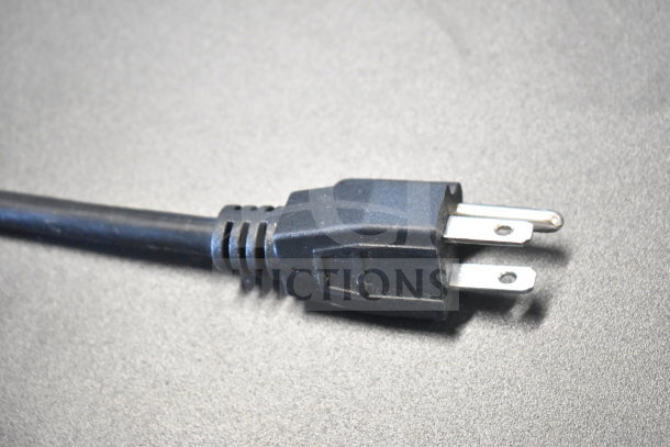 Black electrical plug for the KoolMore DC-3CB bakery display case shown. Three-prong plug, standard design.