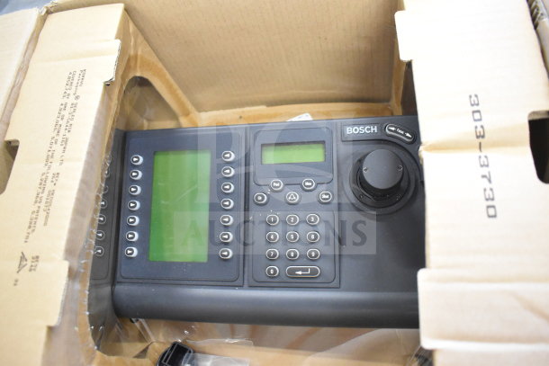 Bosch KBD-DIGITAL IntuiKey Security Keyboard with joystick, dual screens, numeric keypad, and function buttons, in box.