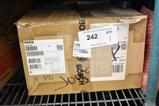 Box containing Bosch KBD-DIGITAL IntuiKey Series Security Keyboard with Joystick, labeled and packaged.