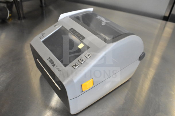 Zebra ZD621 desktop direct thermal barcode printer in excellent condition, features control buttons and clear status indicators.