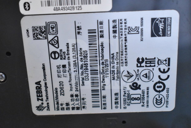 Zebra ZD620 Desktop Direct Thermal Barcode Printer label, showing model and serial number, manufacturing date, and certifications.
