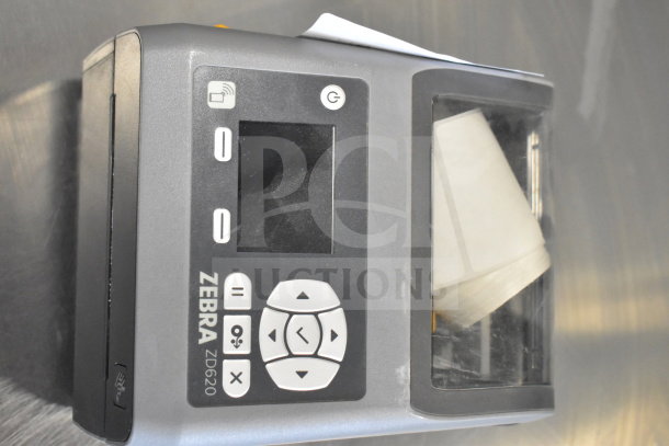 Zebra ZD620 desktop direct thermal barcode printer with control panel. Features labels visible inside. Good condition.