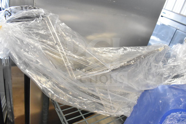 3 brand new scratch and dent items: Choice 18"x12"x1/2" blue polyethylene cutting board, 12.25"x14"x6.5" fryer sediment tray in packaging.