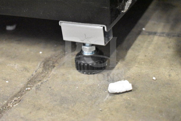 Bottom view of KoolMore KM-MDR-17S refrigerator leg, showing adjustable foot for leveling on uneven surfaces.