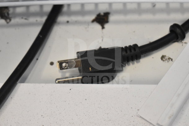 Galaxy 177GDN5RBB refrigerator plug with surrounding debris. Model is missing door, features LED lighting. 110-120V.
