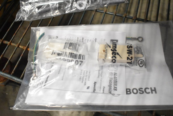 Three items including a shorting cap and Bosch manual in plastic packaging on a metal shelf. Labels indicate model SW-27T.