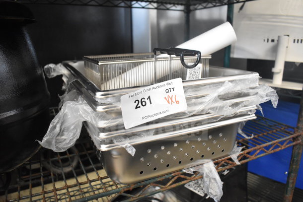 Six scratch and dent trays, perforated design, includes Estella 348PEDS45B outer roller and fry basket. Tag reads "261 QTY x6".