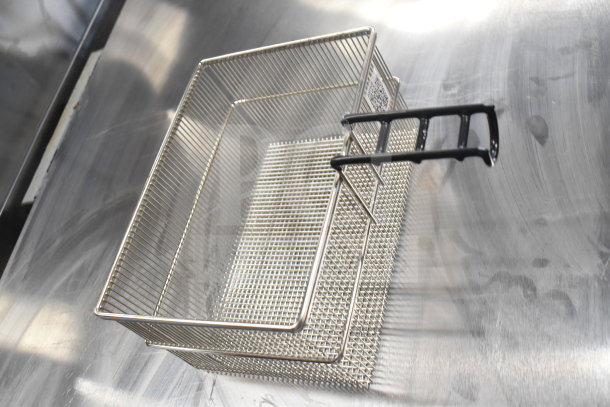 Stainless steel fry basket with black handle on a metallic surface, new condition. Part of a 6-item auction lot.