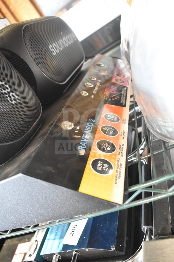 Soundcore store display featuring the Rave Neo 2 speaker with 80W power, IPX7 waterproof rating, and vibrant LEDs.