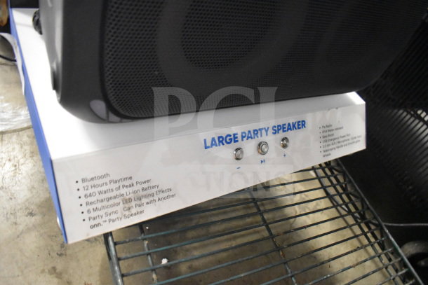 Onn Large Party Speaker store display, features Bluetooth, 12 hours playtime, 640W peak power, rechargeable battery.