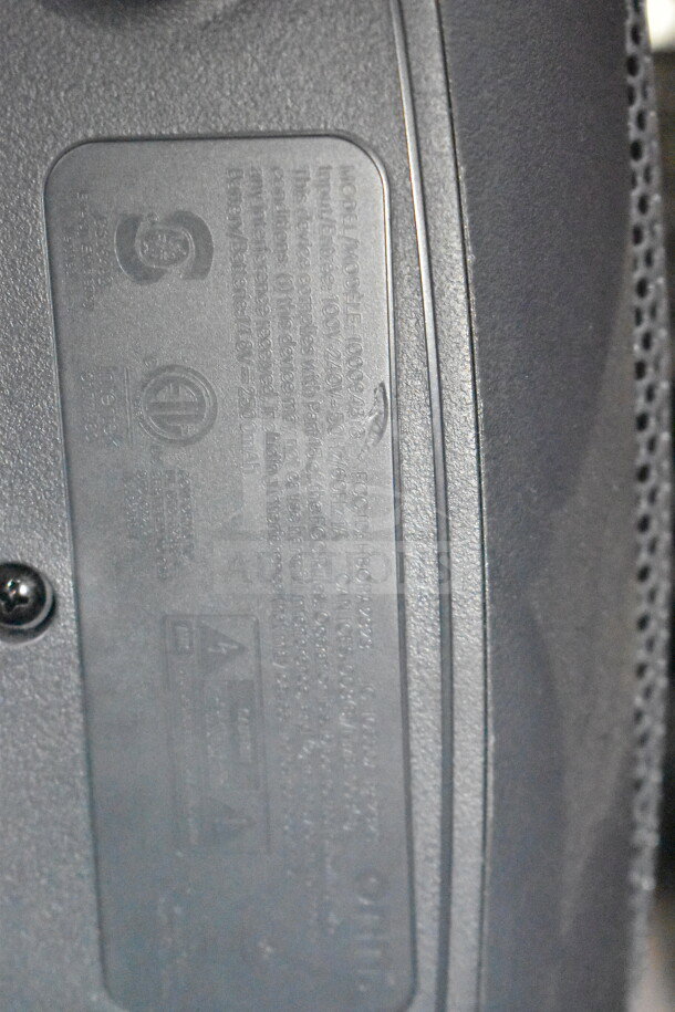 Label on Onn Large Party Speaker model 100097519, showing specifications and safety certifications.