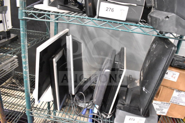 6 assorted computer monitors, including brands like Dell and HP, displayed on a metal rack, in used condition.