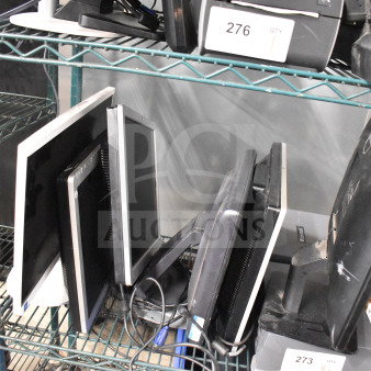 6 assorted computer monitors, including brands like Dell and HP, displayed on a metal rack, in used condition.