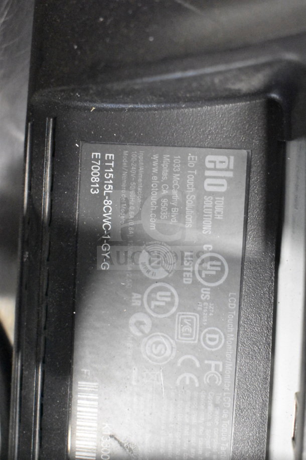 6 various computer monitors, including Dell and HP, in mixed condition. Label shows ELO Touch Solutions. Inspect for specific models.