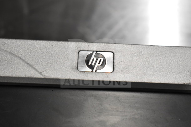 6 computer monitors, including Dell and HP, used. Features HP logo. Auction: 6 times your bid.