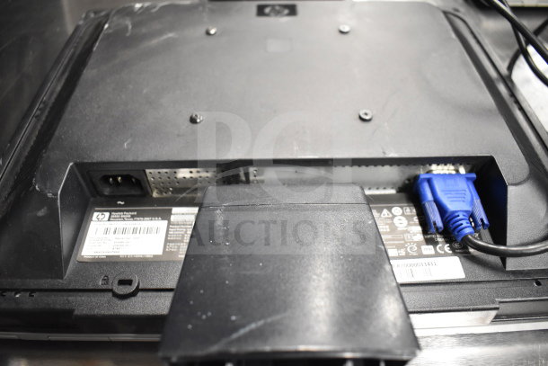 Back view of a computer monitor, featuring a VGA port and HP label with serial number. Light wear visible.