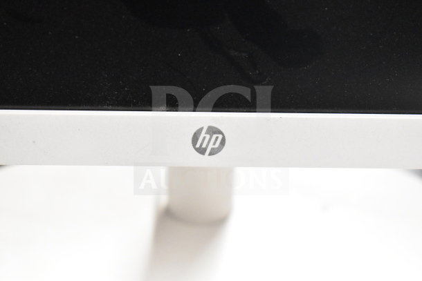 6 computer monitors, including Dell and HP, with visible HP branding, slight wear. Auction includes 6 units total.